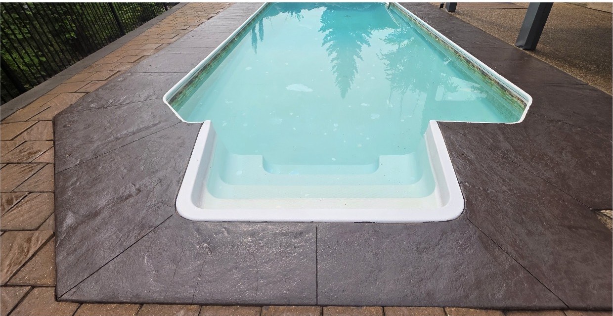 The finished pool deck with a fresh sealer deepening the slate pattern