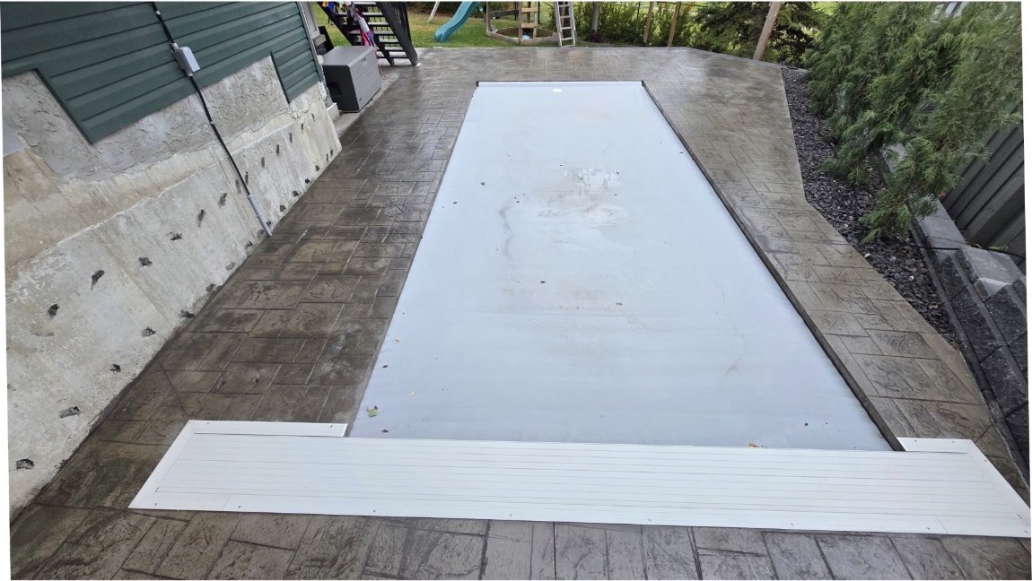 The same pool patio after sealing, with a deeper, more even colour